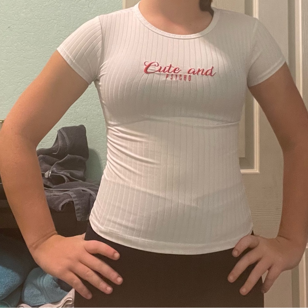 from rue 21, is XS, and is white with red lettering